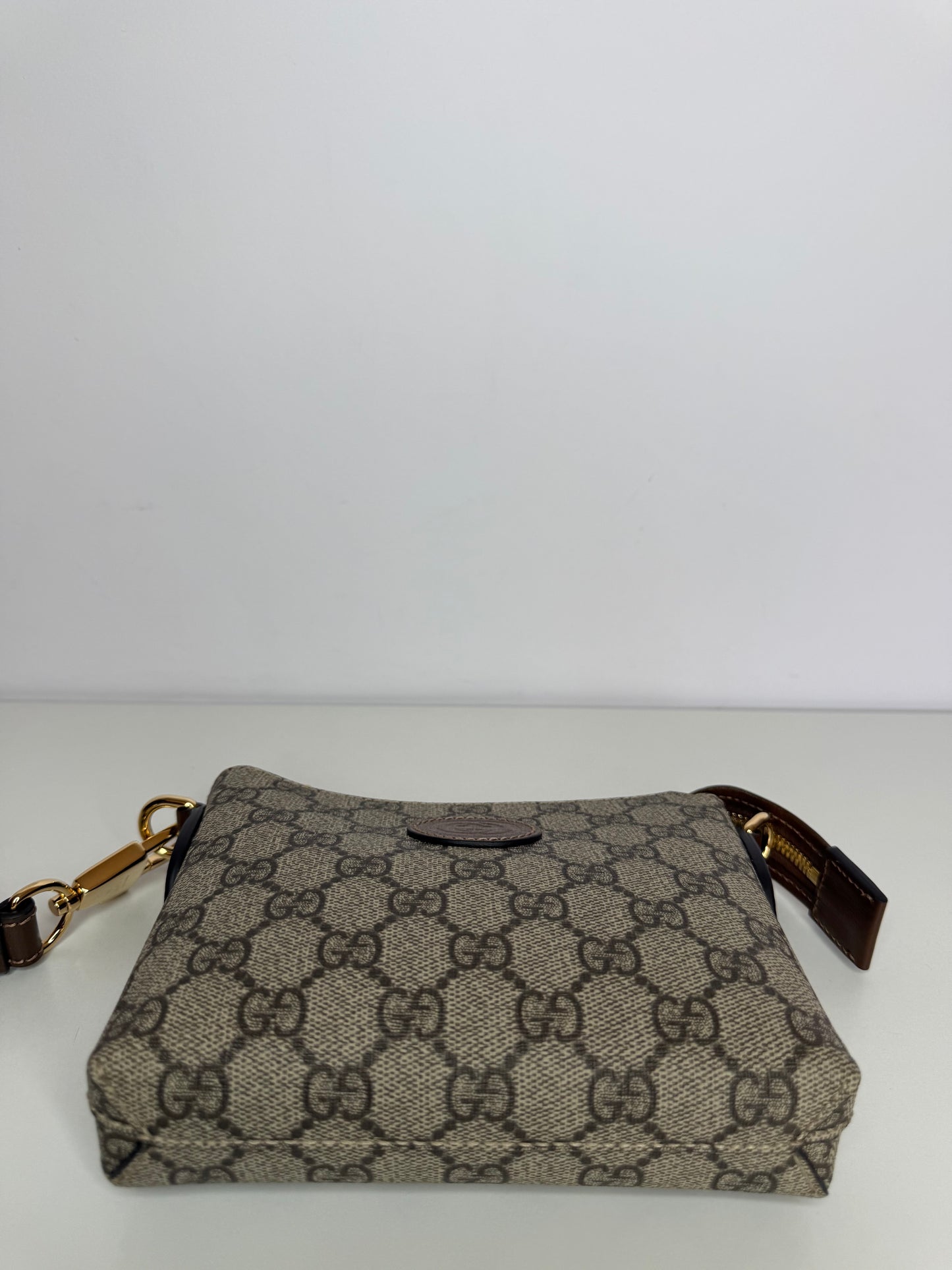 Gucci GG Coated Canvas Interlocking G Patch Wristlet Mini Messenger Bag