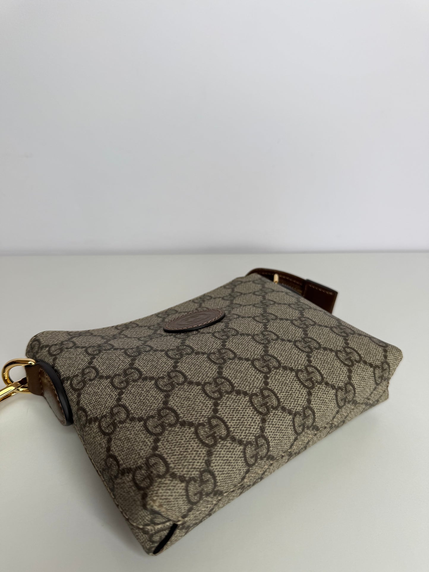 Gucci GG Coated Canvas Interlocking G Patch Wristlet Mini Messenger Bag
