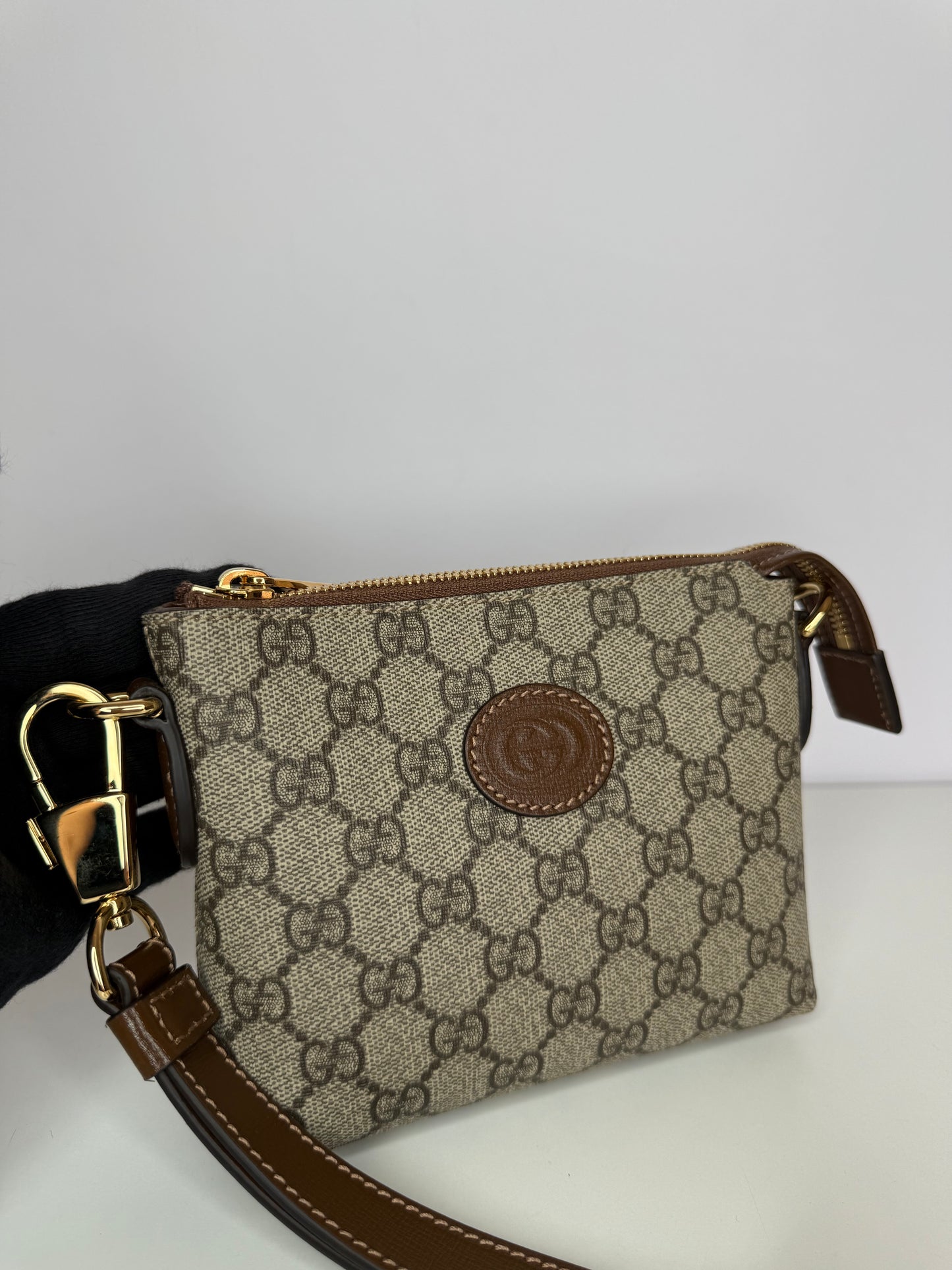 Gucci GG Coated Canvas Interlocking G Patch Wristlet Mini Messenger Bag